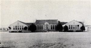 decorative photo of the original Buda High School 